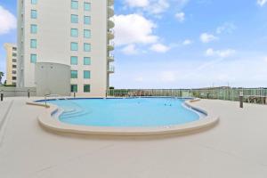 a large swimming pool in front of a building at Perdido Towers West 907 in Perdido Key