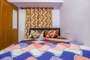 Ένα ή περισσότερα κρεβάτια σε δωμάτιο στο DivBnB homes Whitefield - 1 BHK & 2BHK Near ITPL & Manipal,Vydehi