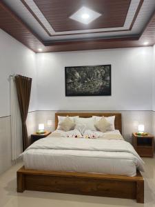 Ένα ή περισσότερα κρεβάτια σε δωμάτιο στο Umah Aget +9 φωτογραφίες