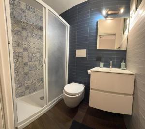 a bathroom with a toilet and a shower and a sink at Graziano's House Case Vacanze in Bari +6 photos