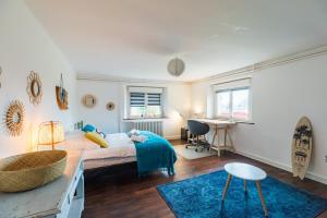 Ένα ή περισσότερα κρεβάτια σε δωμάτιο στο Grande maison conviviale - pour 10 personnes