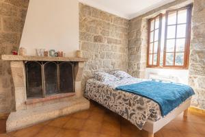 Ένα ή περισσότερα κρεβάτια σε δωμάτιο στο L'OMU DI CAGNA