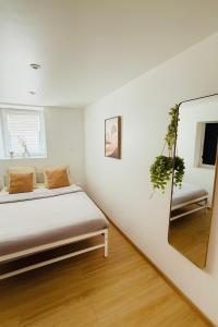 Ένα ή περισσότερα κρεβάτια σε δωμάτιο στο Le Contemporain - Macon Hyper Centre - Proche Gare +8 φωτογραφίες