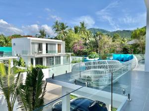 an aerial view of a house with a balcony at Jungle View 3 bedroom Pool Villa in Meanam in Koh Samui 