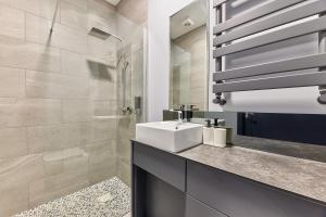 a bathroom with a sink and a shower at Apartment Stays in Newcastle upon Tyne