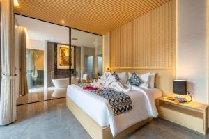 Ένα ή περισσότερα κρεβάτια σε δωμάτιο στο Villa Narda Seminyak by Nagisa Bali +51 φωτογραφίες