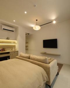 Ένα ή περισσότερα κρεβάτια σε δωμάτιο στο Lens Stay