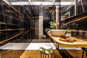a bathroom with a sink and a counter at Ugo Bassi Apartments in Bologna