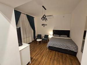 Ένα ή περισσότερα κρεβάτια σε δωμάτιο στο Studio 1920