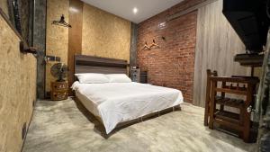 Postel nebo postele na pokoji v ubytování 九份玩具屋