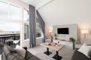 a living room with a couch and a table at Landal Hexham Lodges in Slaley