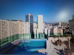 a swimming pool on the roof of a building at Estúdio dos sonhos in Rio de Janeiro
