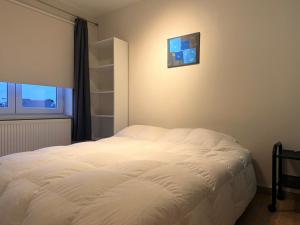 Ένα ή περισσότερα κρεβάτια σε δωμάτιο στο Wimbledon 0202