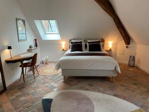 Ένα ή περισσότερα κρεβάτια σε δωμάτιο στο Le Petit Monde de Molly