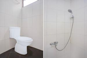 a bathroom with a toilet and a shower at OYO 94785 Diana Homestay Syariah in Sunggal +25 photos