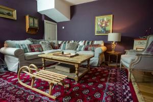 a living room with a couch and a coffee table at Halyon Village in Greencastle
