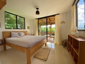 Ένα ή περισσότερα κρεβάτια σε δωμάτιο στο Coral Tree Lodge Tena