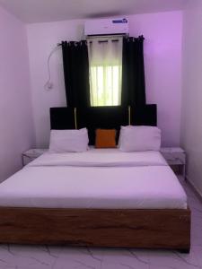 Ένα ή περισσότερα κρεβάτια σε δωμάτιο στο Vivi apartment hotel and suite