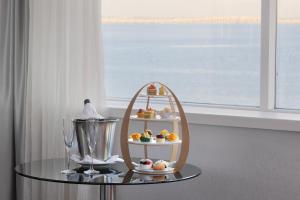 a table with a plate of food and a blender at MYRIAD by SANA Hotels in Lisbon +46 photos
