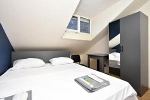 a bedroom with a white bed with a tray on it at tumanyan 38 guest hause in Yerevan