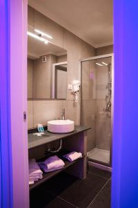 a bathroom with a sink and a shower at Hotel Miravalle in Naples +39 photos