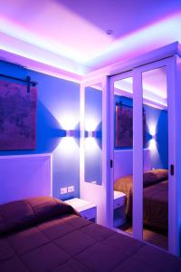 a room with a bedroom with a bed and a mirror at Hotel Miravalle in Naples +39 photos