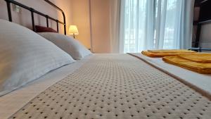 Ένα ή περισσότερα κρεβάτια σε δωμάτιο στο SiviriLovelyApartment