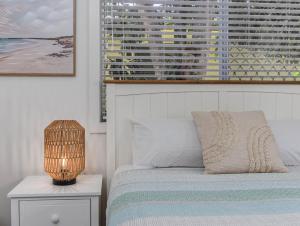 En eller flere senge i et værelse på Dreamtime Dune Studio + 11 billeder