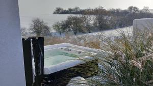 a bath tub sitting on the side of a building at M&D Appartments in Valtice +4 photos
