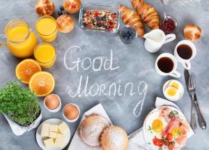 a group of breakfast foods and drinks on a table at Jagdhaus in Mayrhofen