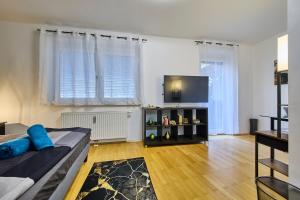 Un televizor și/sau centru de divertisment la Grazer City Residence & Free parking