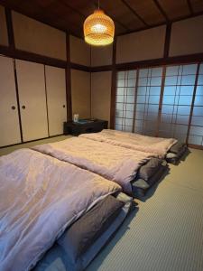 Ένα ή περισσότερα κρεβάτια σε δωμάτιο στο 天宿りAmayadori +55 φωτογραφίες