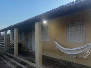 Belo MonteにあるRecanto da florの家の横掛けハンモック +1枚の写真