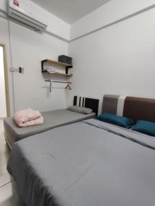 Ένα ή περισσότερα κρεβάτια σε δωμάτιο στο Hygge Living Kampar (Near UTAR) +14 φωτογραφίες