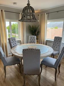a dining room with a table and chairs at Carnglas, Gweedore, County Donegal in Donegal