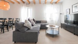 a living room with a couch and a table at San Torcuato VIII by Toledo AP in Toledo