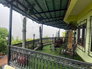 a balcony of a house with a table and chairs at 3BHKVilla Panshet in Lavasa
