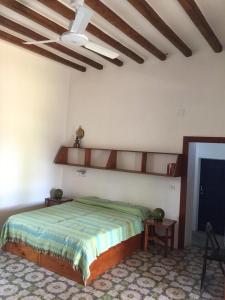 a bedroom with a bed and a ceiling at Casa Moser in Stromboli