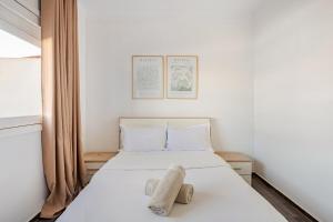 Ένα ή περισσότερα κρεβάτια σε δωμάτιο στο Modern 1 Bedroom W Terrace-Arribat Center