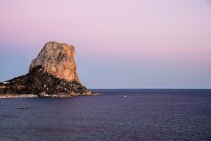 a large rock in the middle of the ocean at Hotel Bahía Calpe by Pierre & Vacances in Calpe