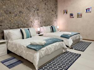 Postel nebo postele na pokoji v ubytování Loft Mueganos III en Val´Quirico