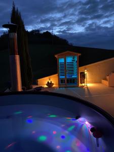 a night view of a hot tub in a backyard at Tramontana Casetta in Castilenti