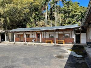 a building with a street in front of it at 茄苳仔23民宿 in Zhuqi