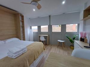 Ένα ή περισσότερα κρεβάτια σε δωμάτιο στο Precioso loft para disfrutar de Ourense +11 φωτογραφίες