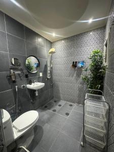 a bathroom with a toilet and a sink at Ryad Lalla khadija in Marrakech