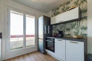 Η κουζίνα ή μικρή κουζίνα στο Spacieux appartement vue sur mer - Saint-Brieuc