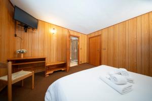 Postel nebo postele na pokoji v ubytování Locanda del Lysjoch