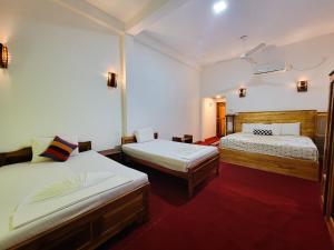 Postel nebo postele na pokoji v ubytování River Resort by The Ceylon Adventure Sports Kithulgala