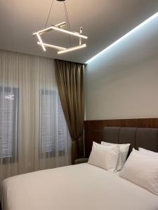 Ένα ή περισσότερα κρεβάτια σε δωμάτιο στο Vila 12