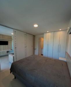 En eller flere senge i et værelse på Ponta Negra Flat - Melon Flat + 7 billeder